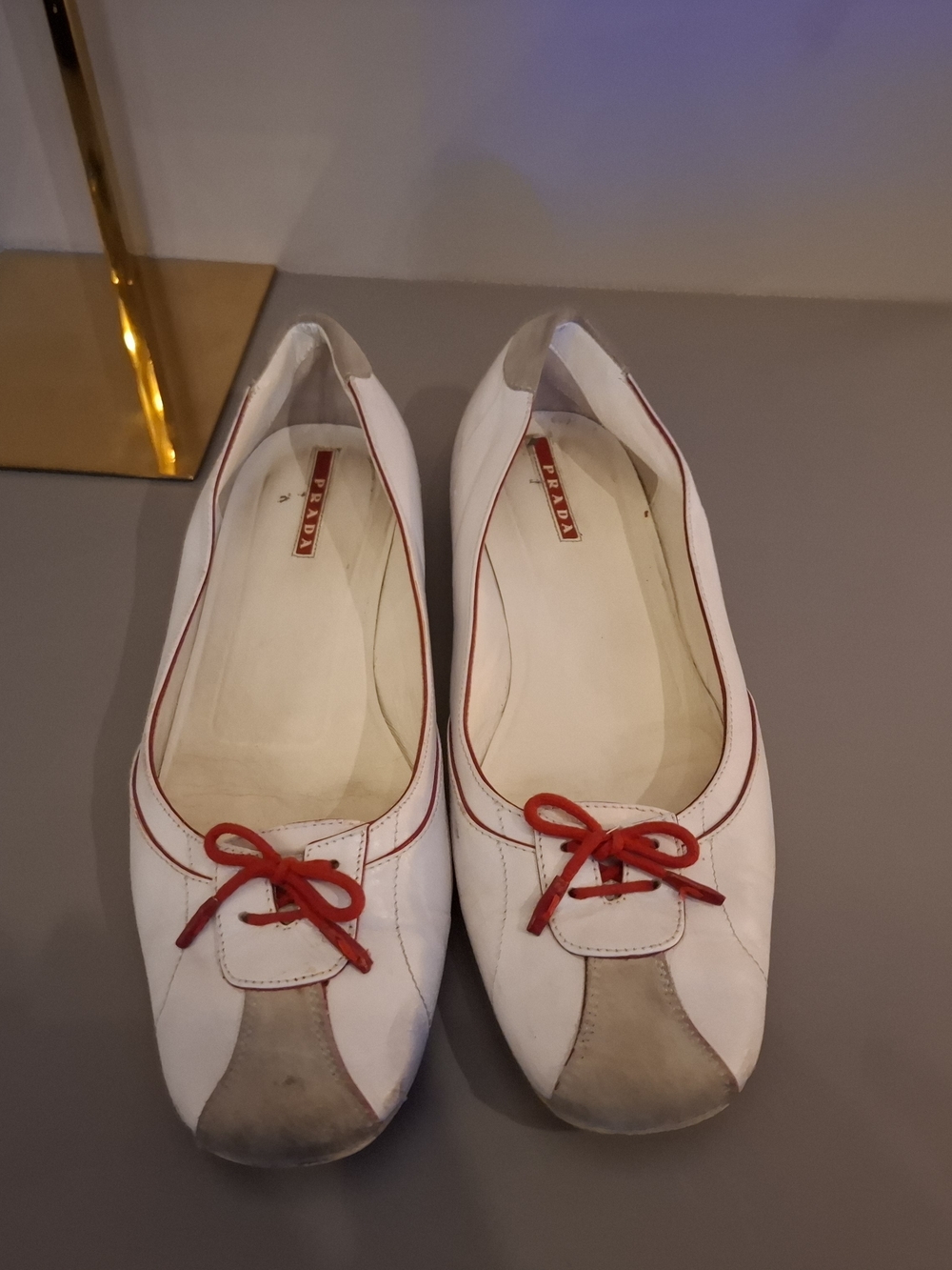 Prada White Leather Ballet Flats with Red Bow Trim